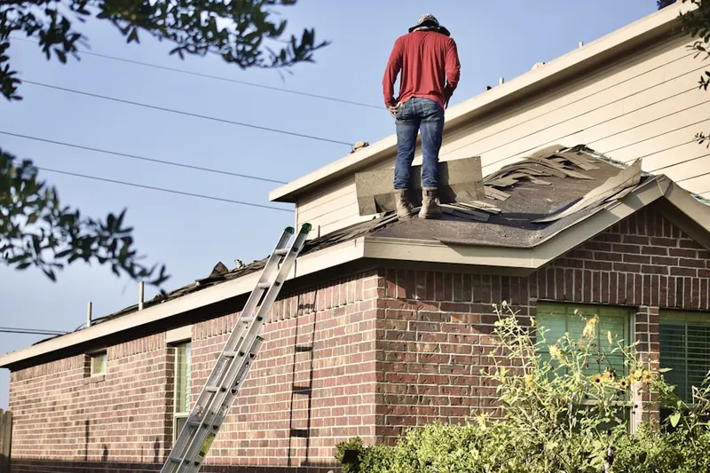 Professional roofer working on a residential roof in Lake Bluff
